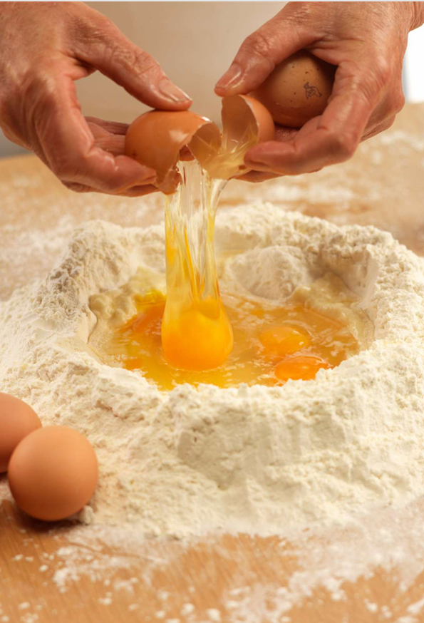 Learning to prepare traditional Italian dishes during a private cooking class
